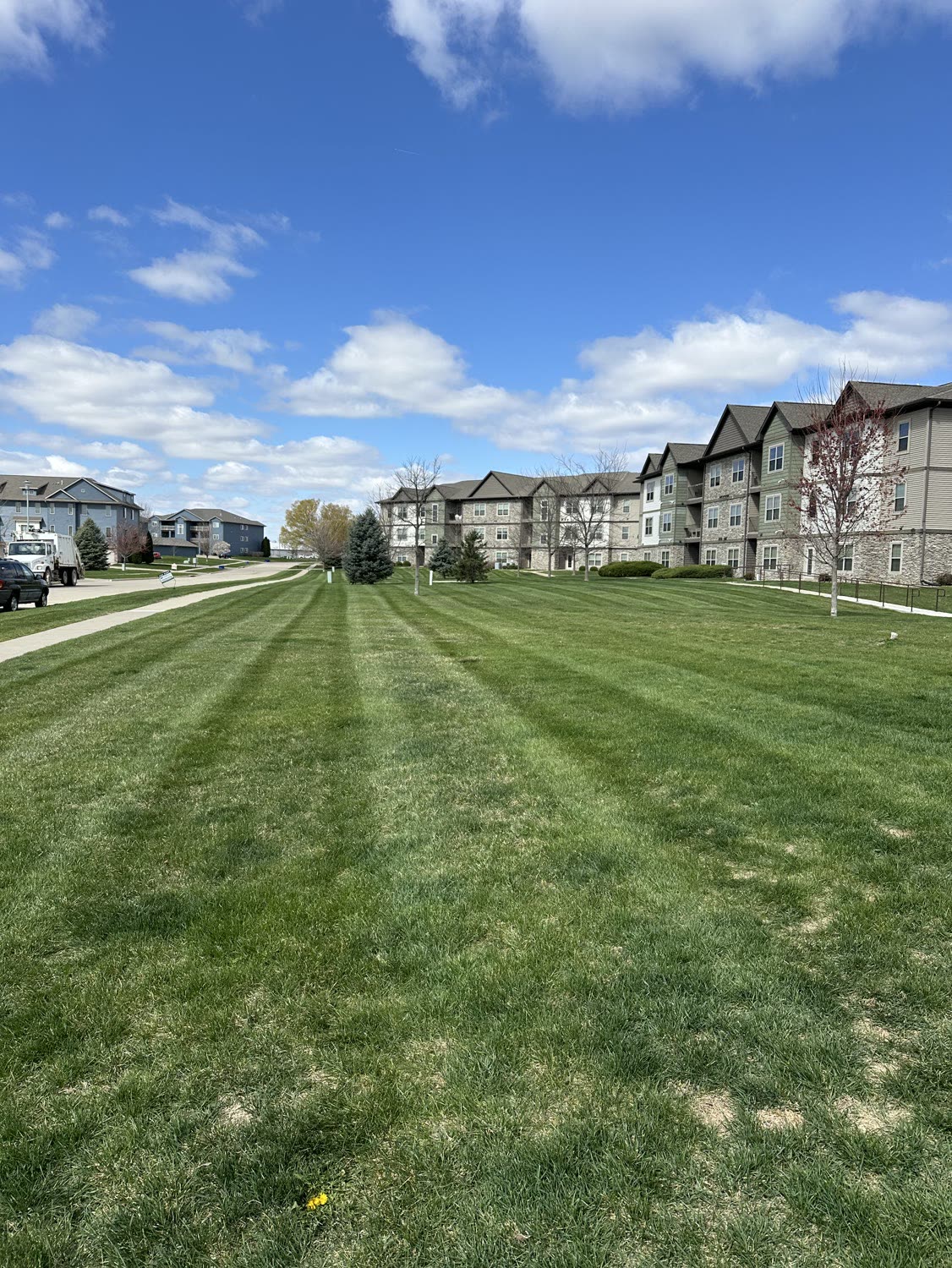 Long striped lawn running between apartment buildings